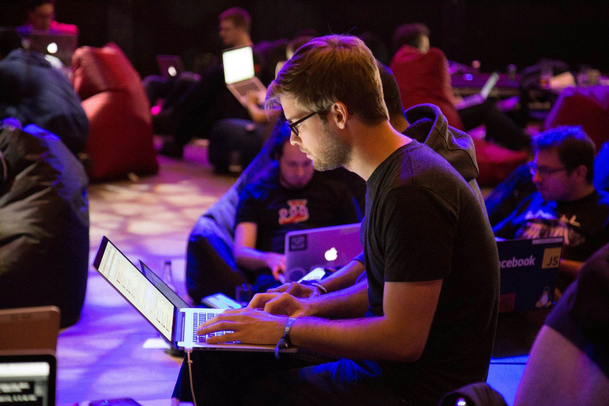 attendees at event using laptops