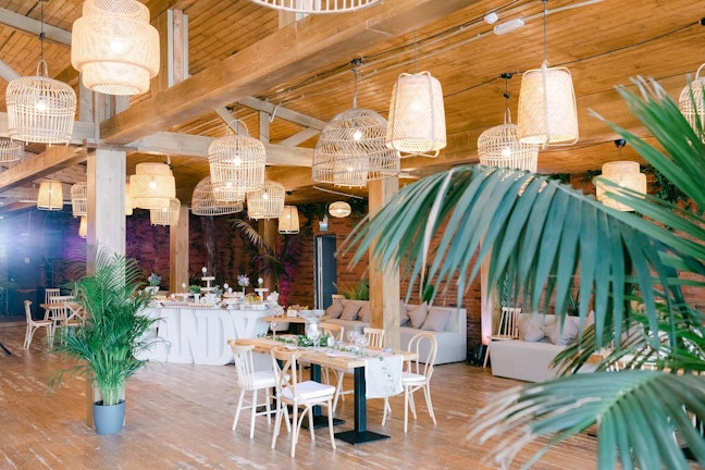 a venue with palm trees and lamps