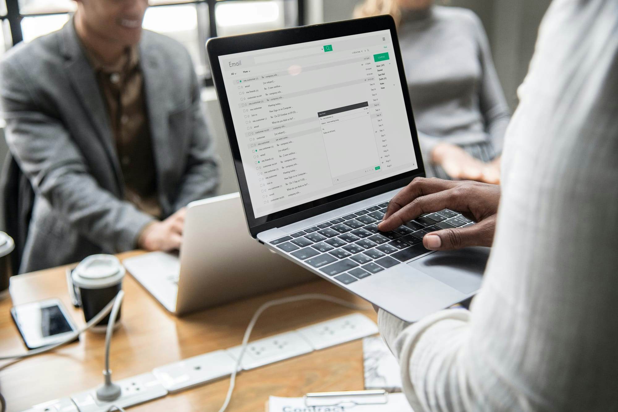 Person checking their emails on laptop