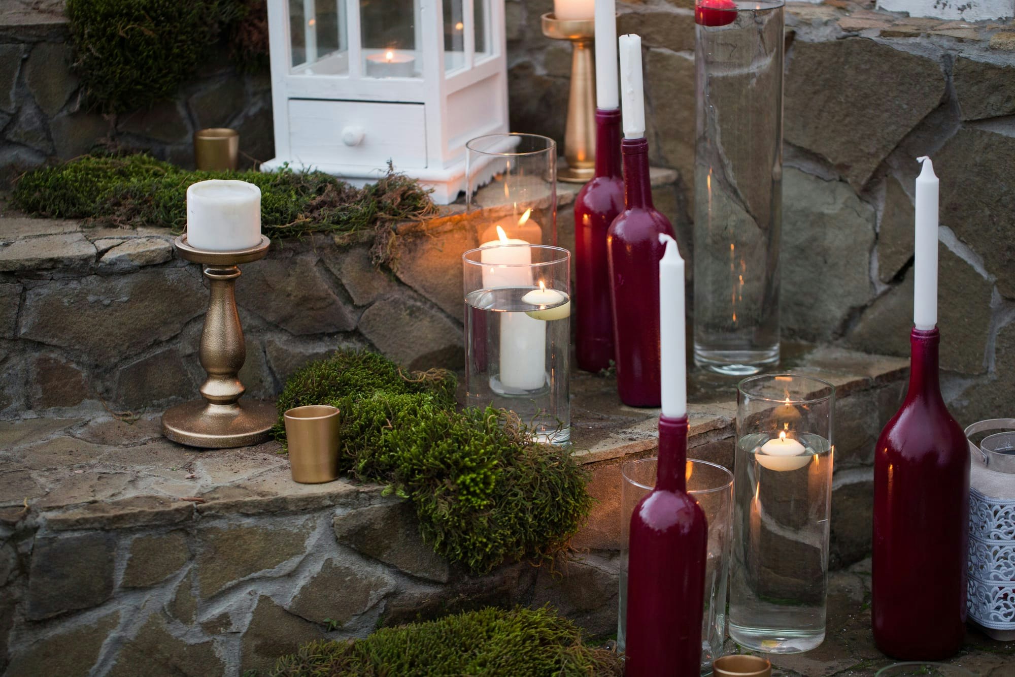 Candle holders using glass bottles